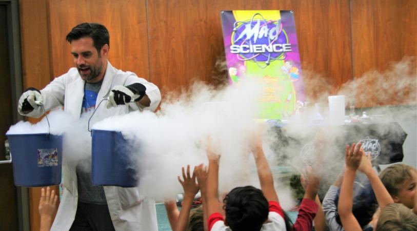 Mad Science smoke presentation with children in audience